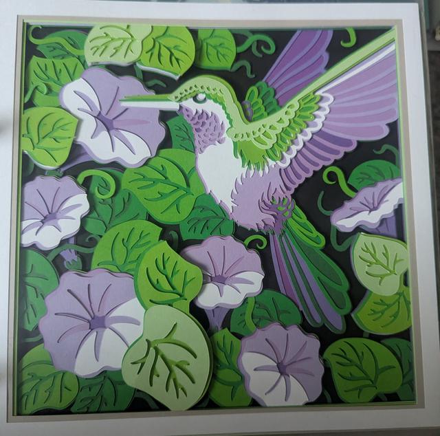 Layered paper artwork by Card and Canvas