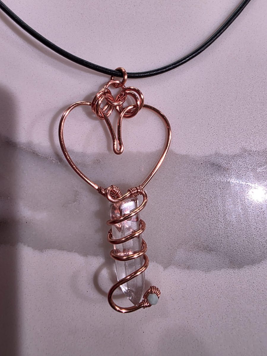 Copper heart pendant with wrapped clear quartz